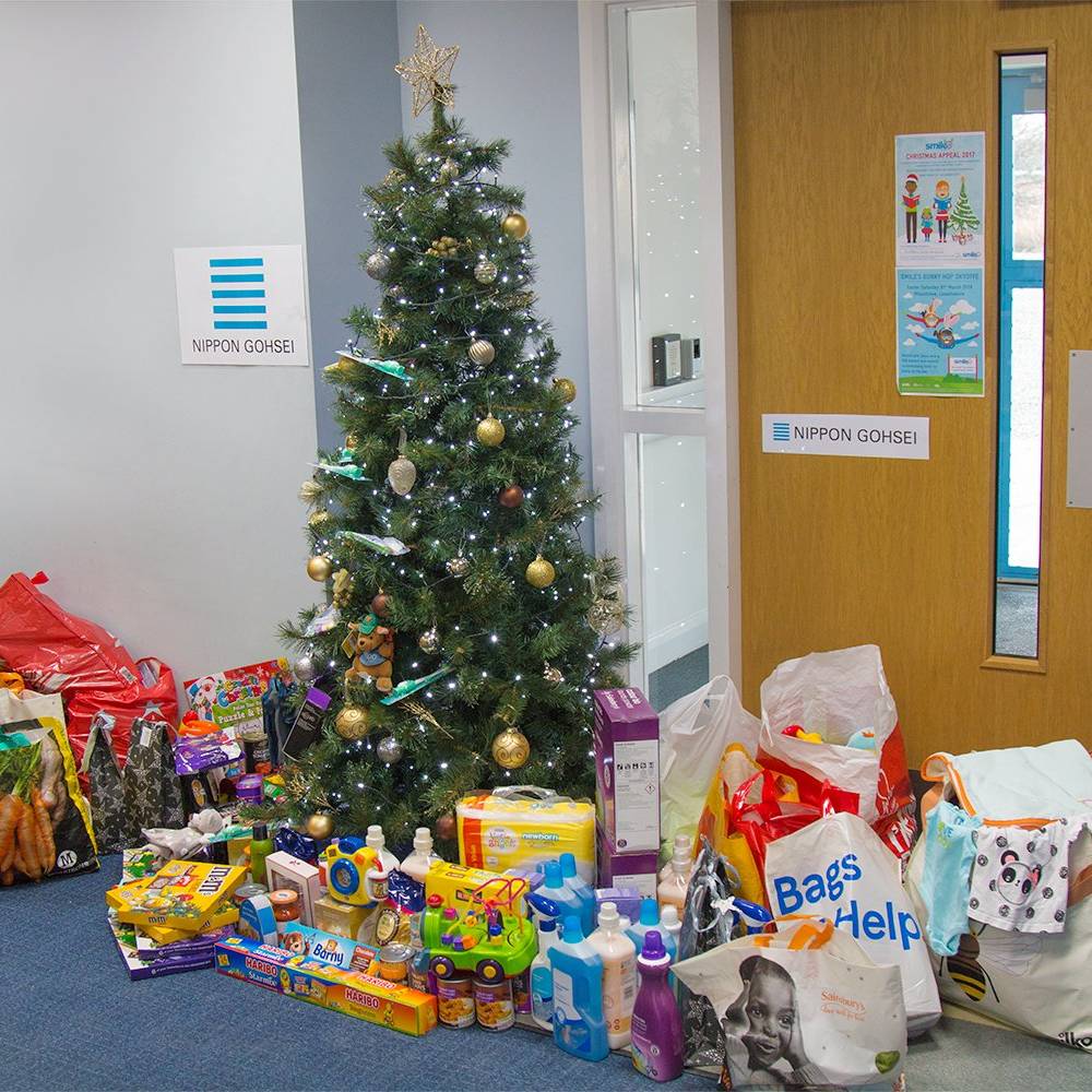 Three children from Hull KR holding up an Easter Egg they received form the appeal