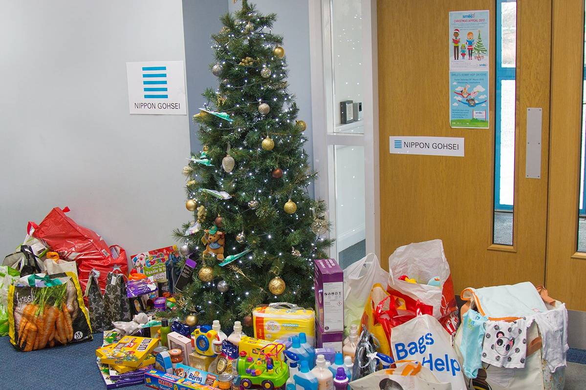 Three children from Hull KR holding up an Easter Egg they received form the appeal