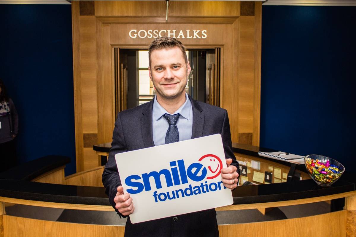 Solicitor standing in Gosschalks' reception