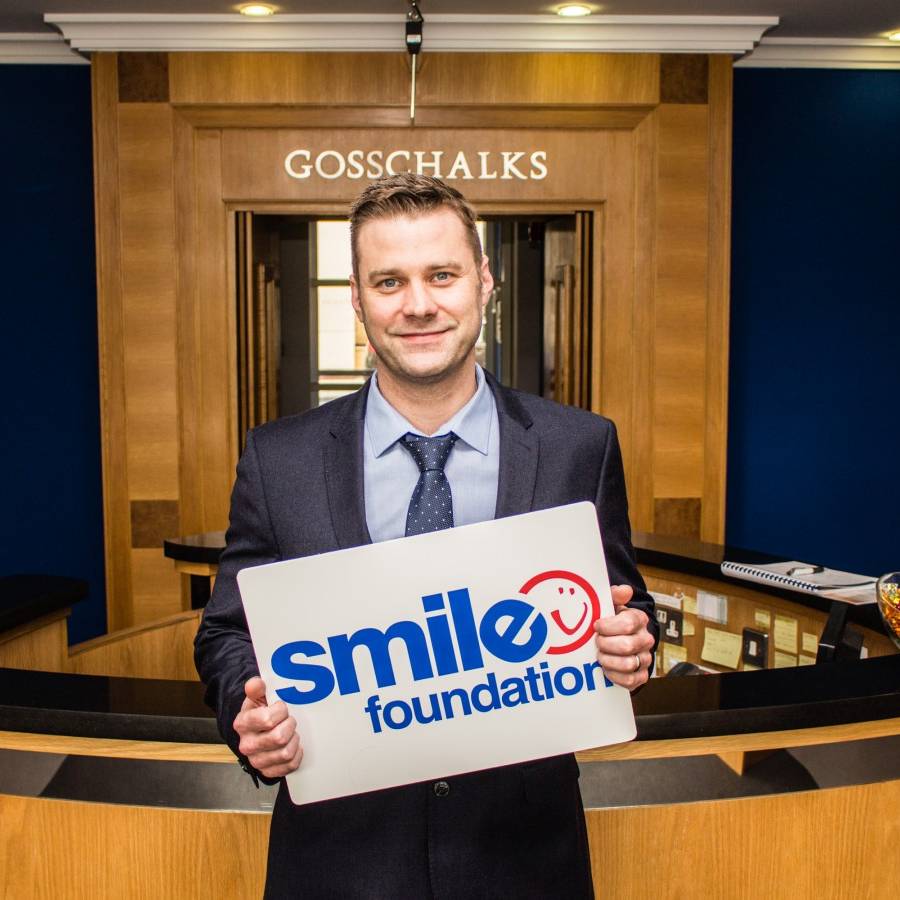 Solicitor standing in Gosschalks' reception